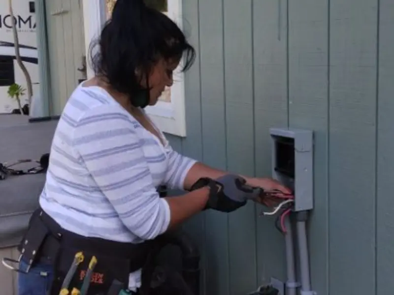 Licensed electrician wiring an exterior subpanel in Canastota